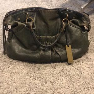 Navy Botkier bag.has double handles shoulder strap